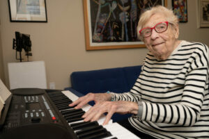 The late Bea Rossman plays her keyboard at The Hearth at Drexel.