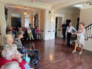 Ballroom dancers entertain residents during a community life event at The Hearth at Drexel, an assisted living and memory care community serving the Philadelphia area