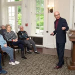 A lecturer delivers a stimulating lecture as residents watch at The Hearth at Drexel in Bala Cynwyd, PA.
